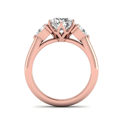 Round cut lab grown diamond three stone engagement ring with pear side diamonds in rose gold.