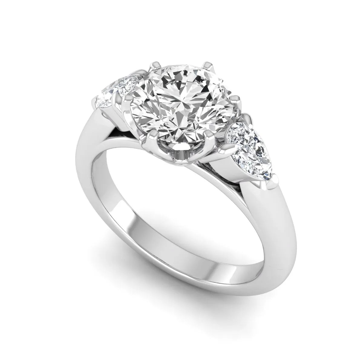 Round cut lab grown diamond three stone engagement ring with pear side diamonds in white gold.