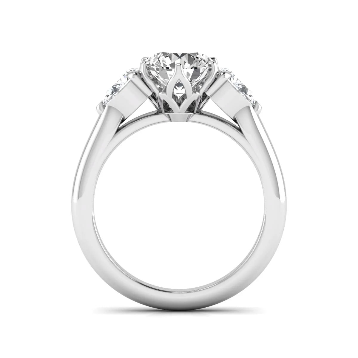 Round cut lab grown diamond three stone engagement ring with pear side diamonds in white gold.