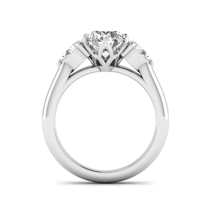 Round cut lab grown diamond three stone engagement ring with pear side diamonds in white gold.