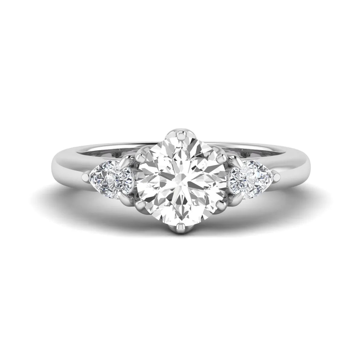 Round cut lab grown diamond three stone engagement ring with pear side diamonds in white gold.