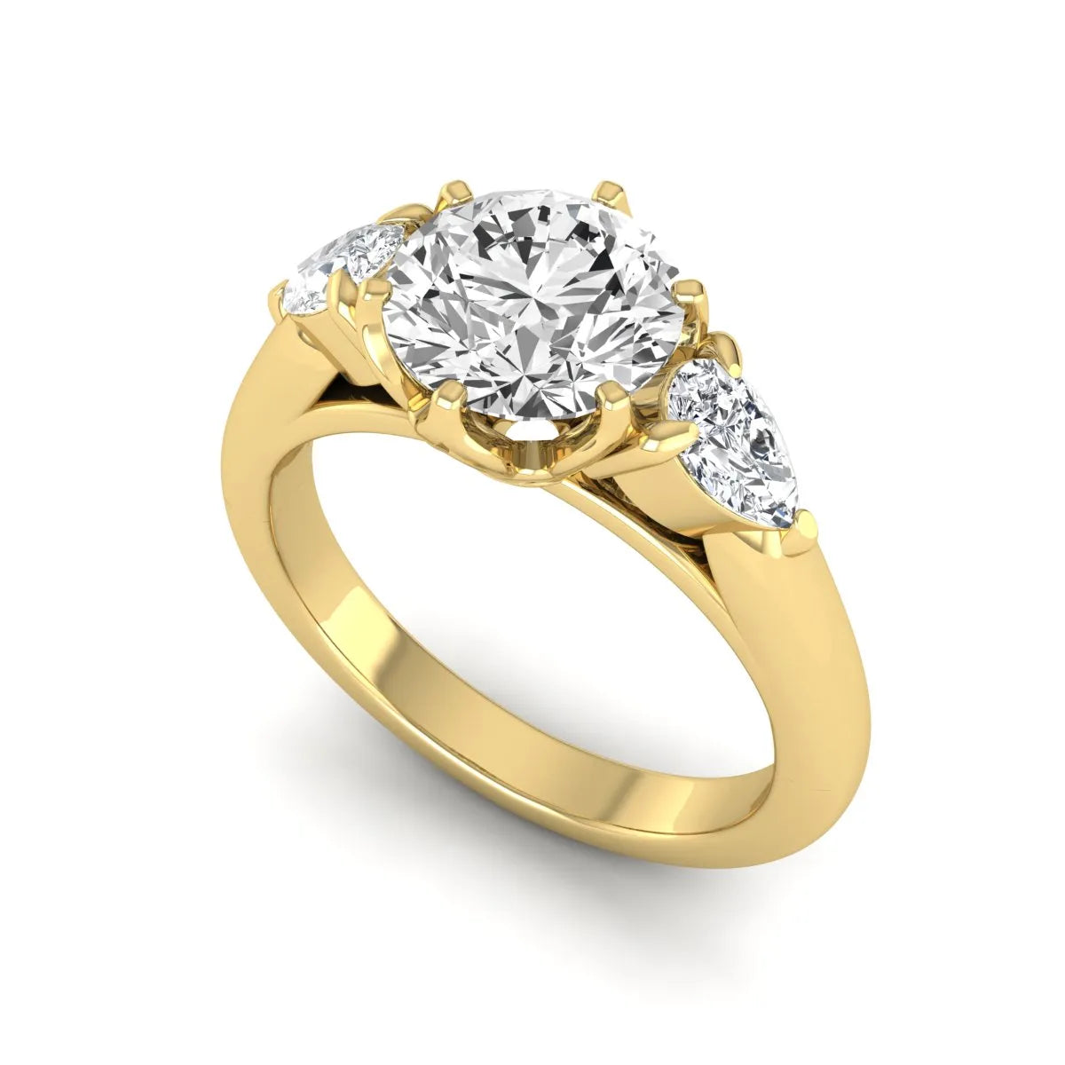 Round cut lab grown diamond three stone engagement ring with pear side diamonds in yellow gold.