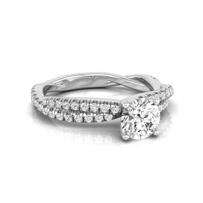 Round cut lab grown diamond engagement ring featuring a twisted pavé diamond shank in white gold.