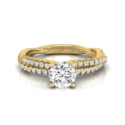 Round cut lab grown diamond engagement ring featuring a twisted pavé diamond shank in yellow gold.