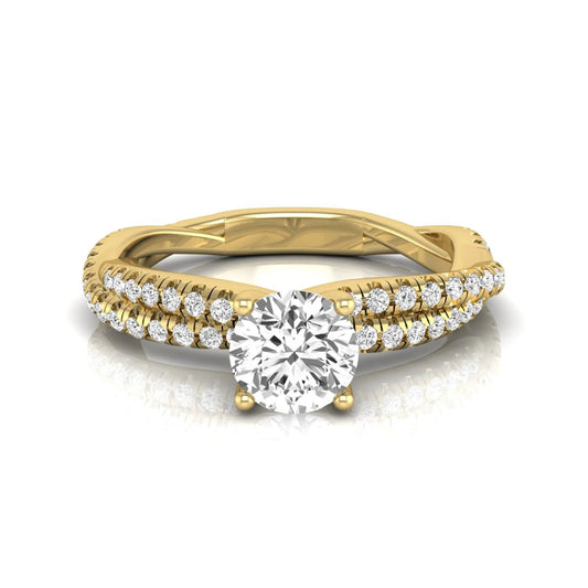 Round cut lab grown diamond engagement ring featuring a twisted pavé diamond shank in yellow gold.