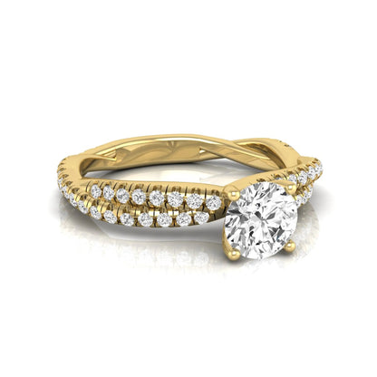 Round cut lab grown diamond engagement ring featuring a twisted pavé diamond shank in yellow gold.