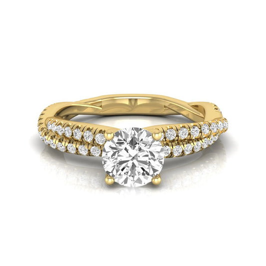 Round cut lab grown diamond engagement ring with twisted pavé diamond crossover band in yellow gold.