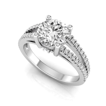 Round cut lab grown diamond engagement ring featuring a 1.28 carat center diamond in a four-prong setting with a pavé split shank and polished white gold finish.