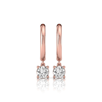 Round cut lab grown diamond drop huggie hoop earrings featuring a four prong drop setting, hinged snap closure, and polished rose gold tone finish.