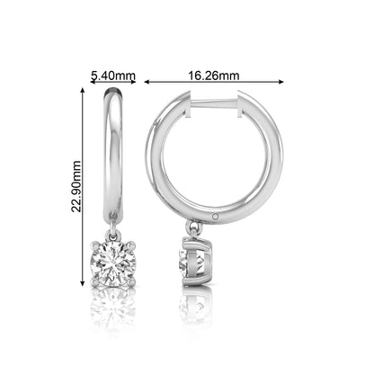 Round cut lab grown diamond drop huggie hoop earrings featuring a four prong drop setting, hinged snap closure, and polished white gold tone finish.