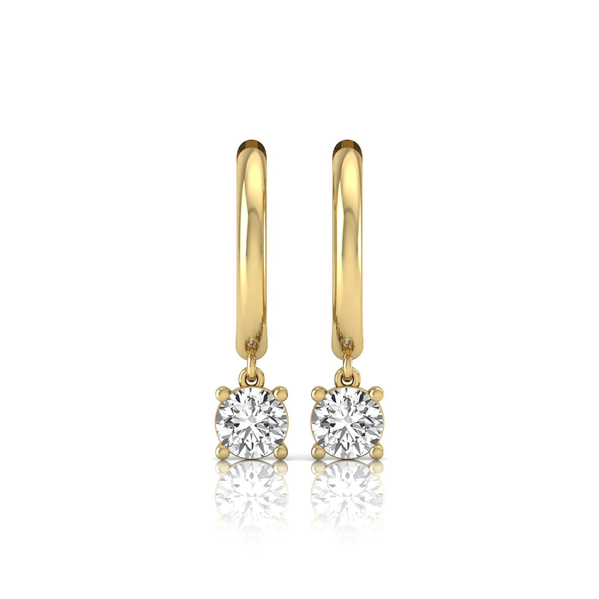 Round cut lab grown diamond drop huggie hoop earrings featuring a four prong drop setting, hinged snap closure, and polished yellow gold tone finish.