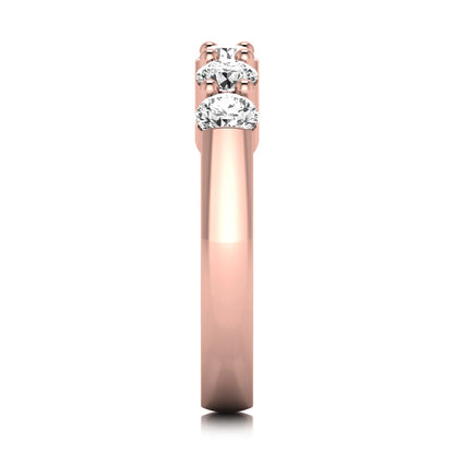 Round cut five stone lab grown diamond anniversary ring featuring a shared prong setting with a polished rose gold finish band.