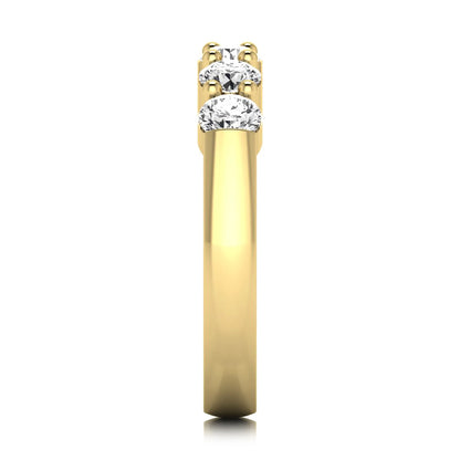 Round cut five stone lab grown diamond anniversary ring featuring a shared prong setting with a polished yellow gold finish band.
