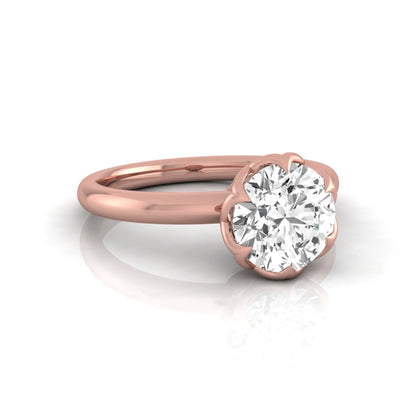 Round cut lab grown diamond solitaire engagement ring featuring a 2.04 carat IGI certified center diamond in a flower-inspired six-prong setting with a rose gold design.