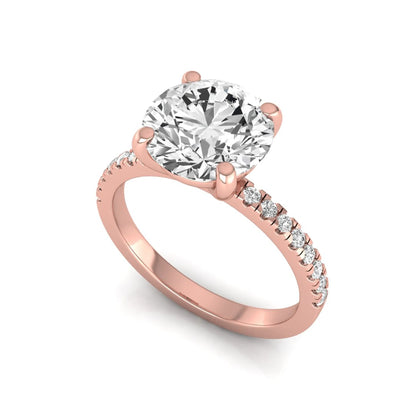 Round channel set lab grown diamond three stone ring with rose gold metal tone and modern geometric design.