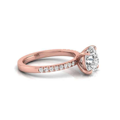 Round channel set lab grown diamond three stone ring with rose gold metal tone and modern geometric design.