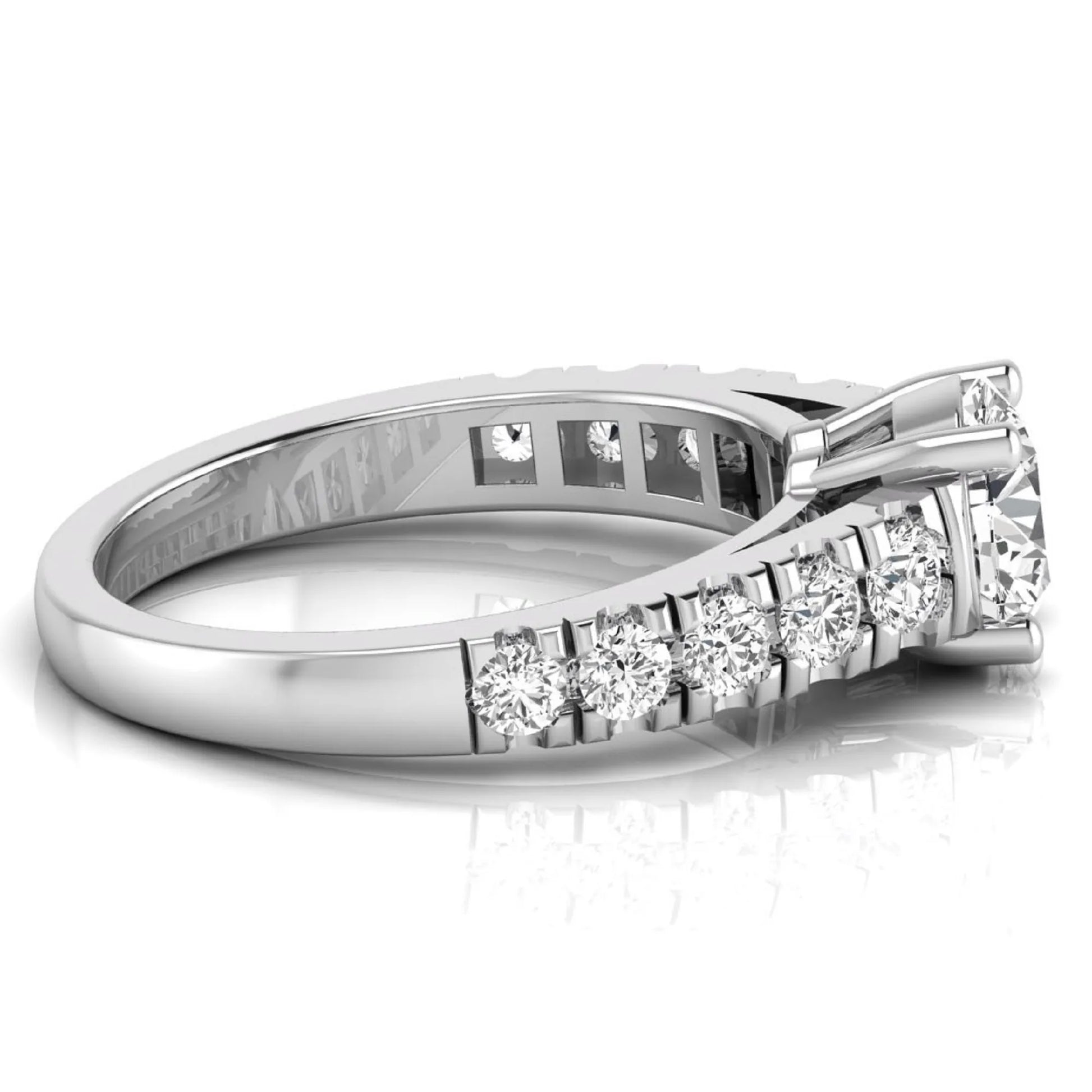 Round cut lab grown diamond side stone engagement ring featuring a four-prong setting with round accent diamonds in a white gold tone design.
