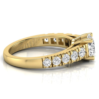 Round cut lab grown diamond side stone engagement ring featuring a four-prong setting with round accent diamonds in a yellow gold tone design.