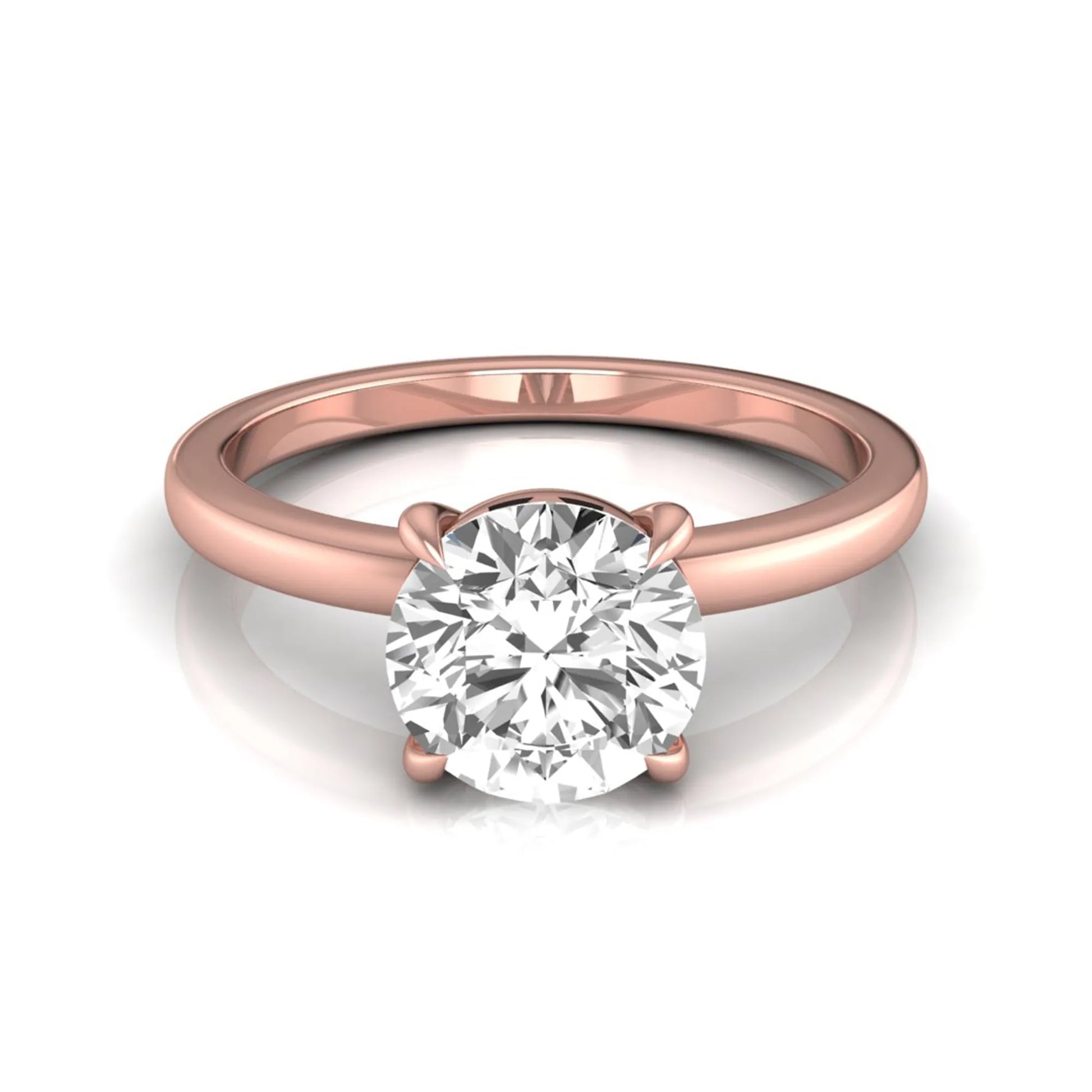 Round cut lab grown diamond solitaire engagement ring featuring a classic four-prong setting with a rose gold tone band.