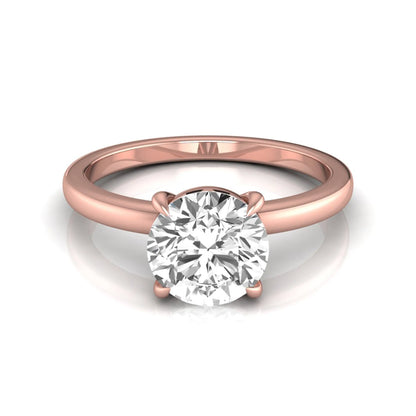 Round cut lab grown diamond solitaire engagement ring featuring a classic four-prong setting with a rose gold tone band.