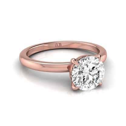 Round cut lab grown diamond solitaire engagement ring featuring a classic four-prong setting with a rose gold tone band.