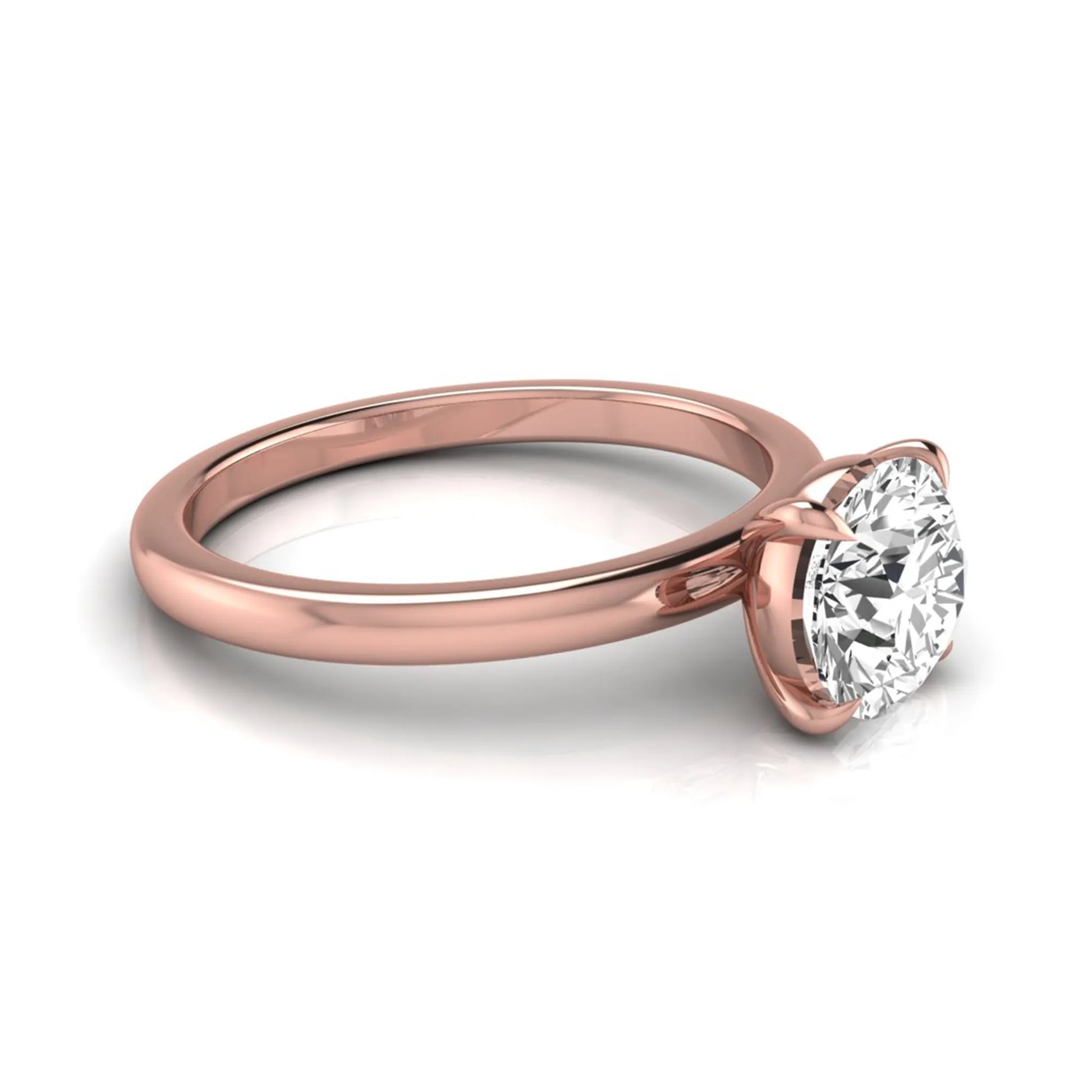 Round cut lab grown diamond solitaire engagement ring featuring a classic four-prong setting with a rose gold tone band.
