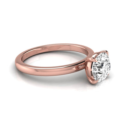Round cut lab grown diamond solitaire engagement ring featuring a classic four-prong setting with a rose gold tone band.