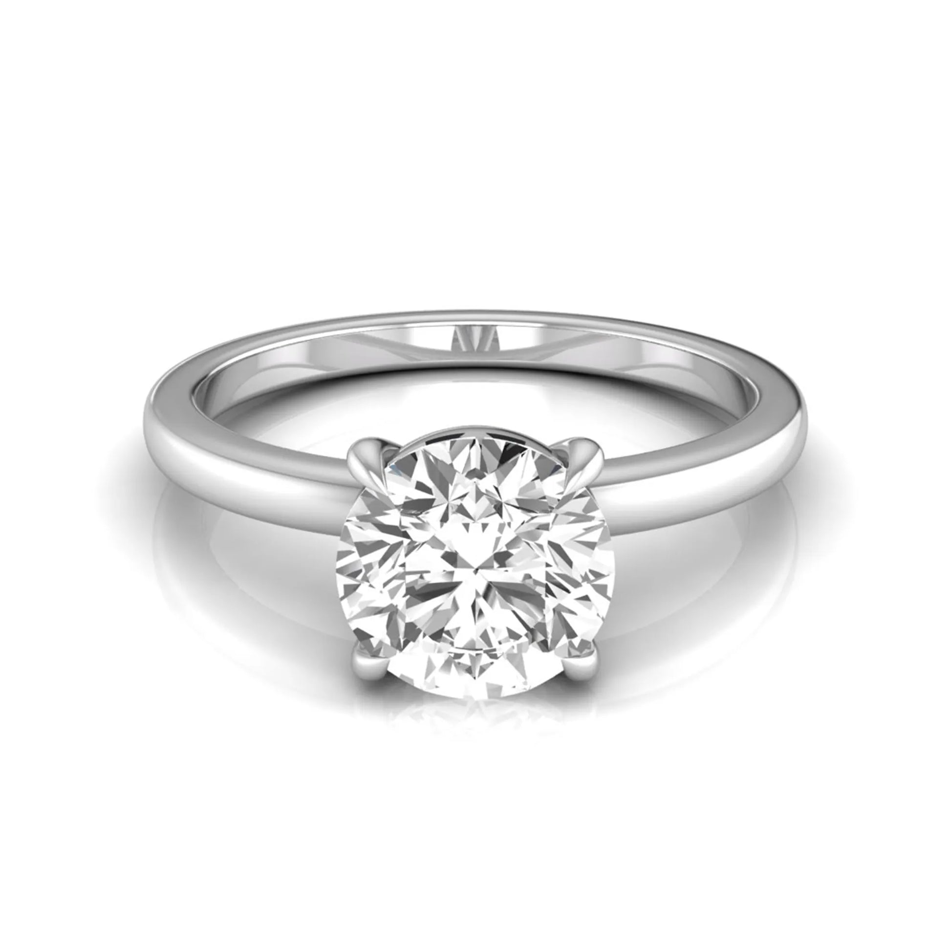 Round cut lab grown diamond solitaire engagement ring featuring a classic four-prong setting with a white gold tone band.