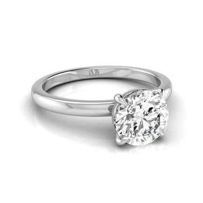 Round cut lab grown diamond solitaire engagement ring featuring a classic four-prong setting with a white gold tone band.