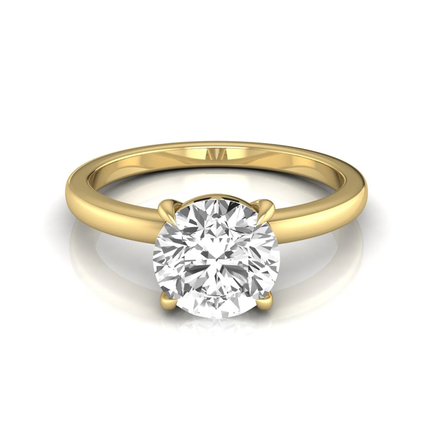 Round cut lab grown diamond solitaire engagement ring featuring a classic four-prong setting with a yellow gold tone band.