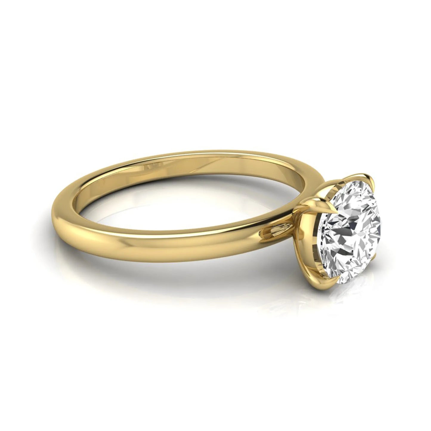 Round cut lab grown diamond solitaire engagement ring featuring a classic four-prong setting with a yellow gold tone band.