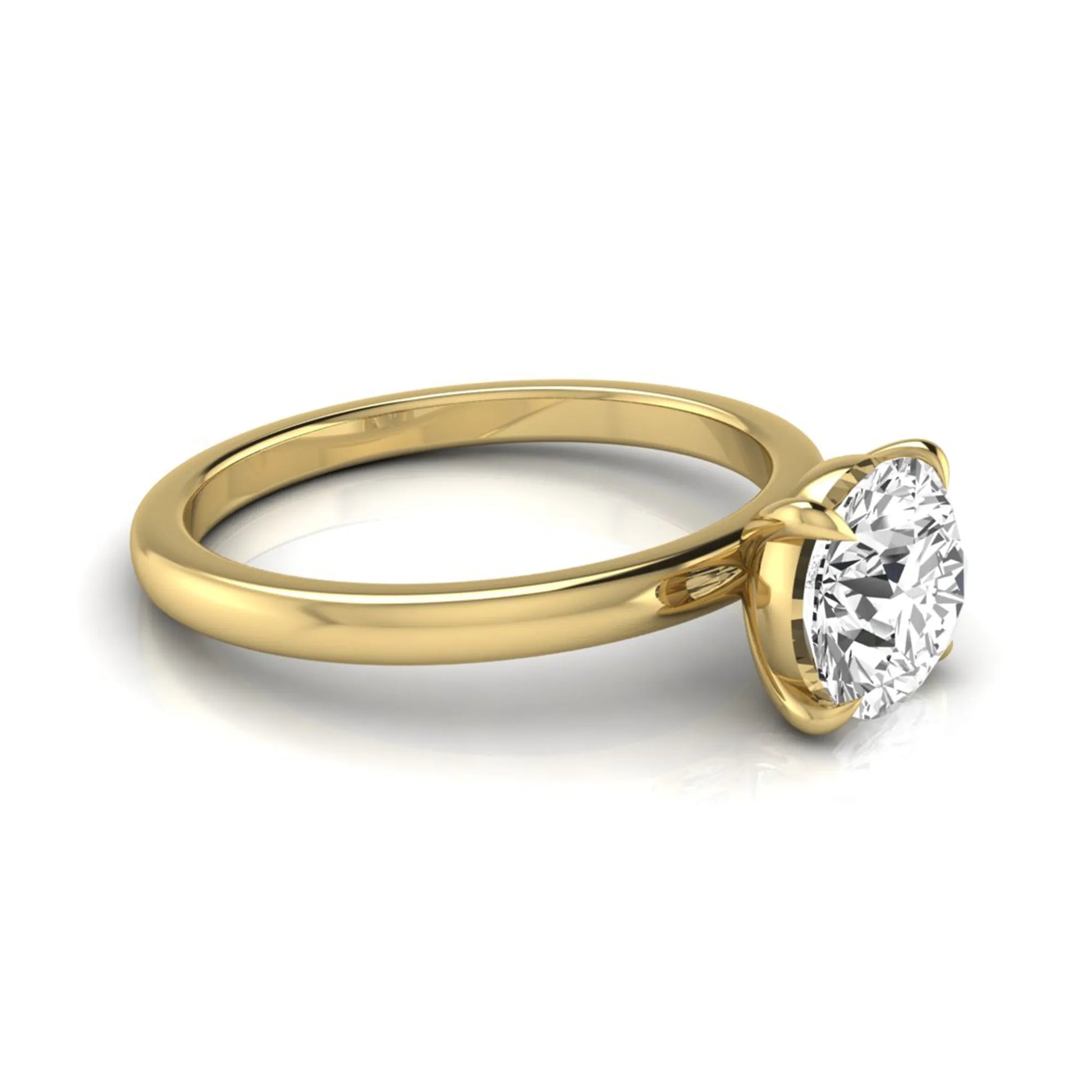 Round cut lab grown diamond solitaire engagement ring featuring a classic four-prong setting with a yellow gold tone band.