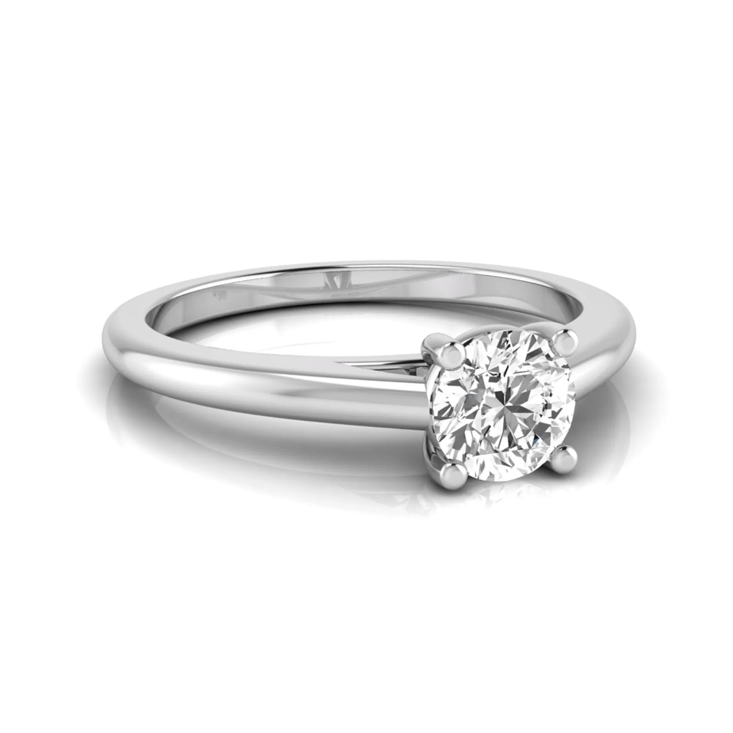 Round cut lab grown diamond solitaire engagement ring featuring a classic four-prong setting with a white gold tone band.