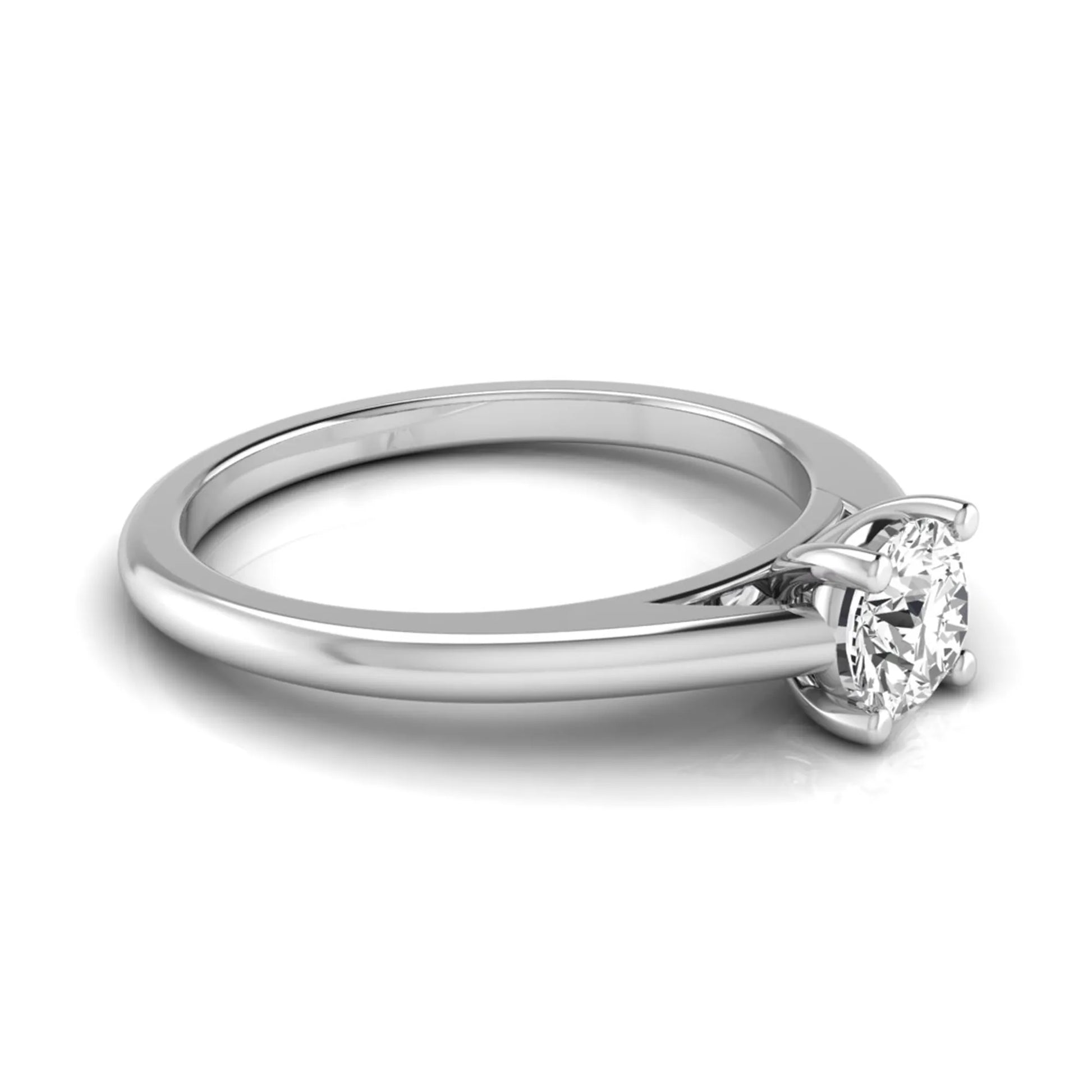 Round cut lab grown diamond solitaire engagement ring featuring a classic four-prong setting with a white gold tone band.