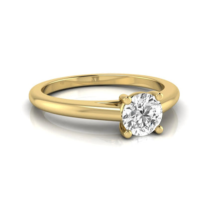 Round cut lab grown diamond solitaire engagement ring featuring a classic four-prong setting with a yellow gold tone band.