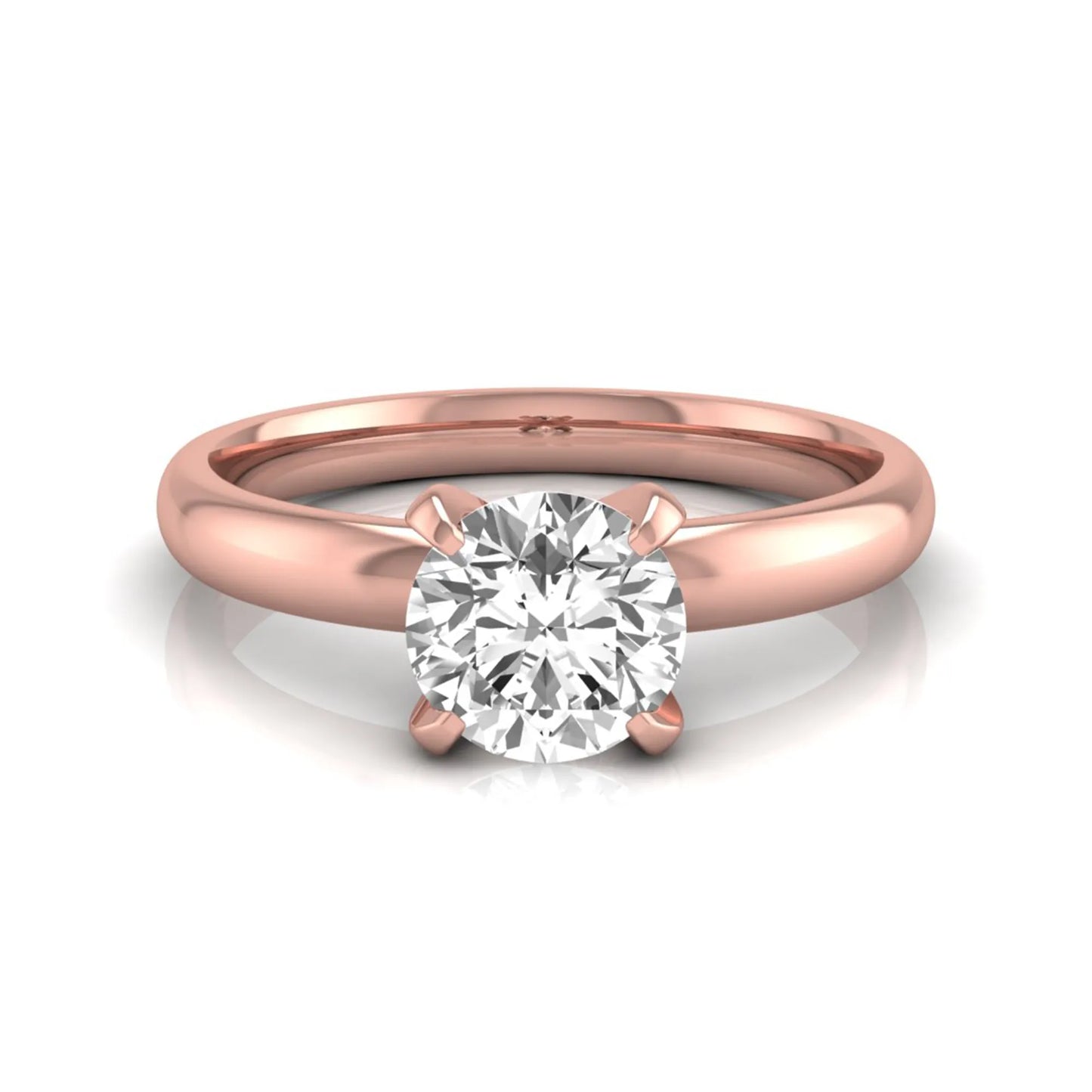Round four prong lab grown diamond solitaire engagement ring featuring a 0.62 carat round center diamond in a classic four-prong setting in rose gold