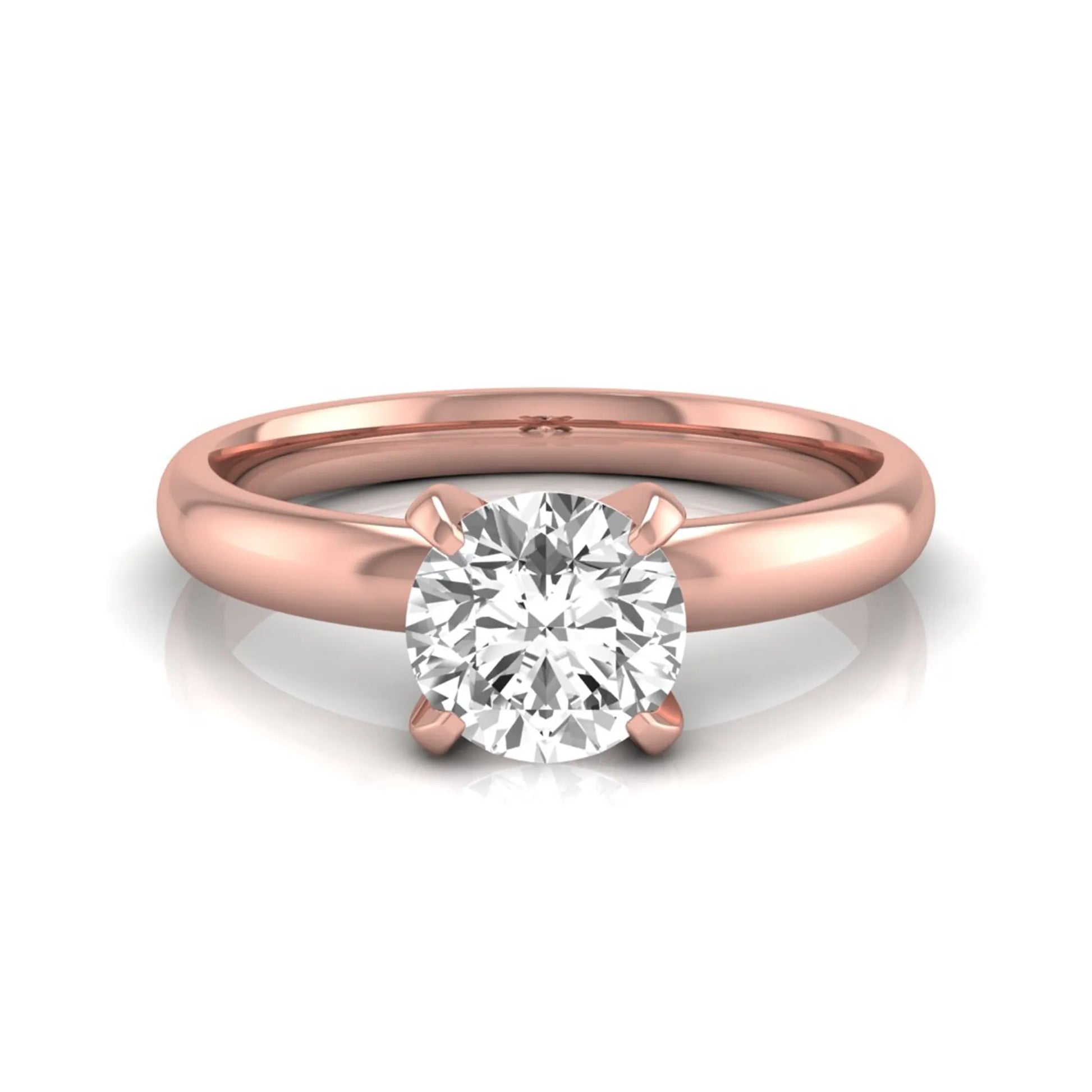 Round four prong lab grown diamond solitaire engagement ring featuring a 0.62 carat round center diamond in a classic four-prong setting in rose gold