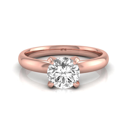 Round four prong lab grown diamond solitaire engagement ring featuring a 0.62 carat round center diamond in a classic four-prong setting in rose gold