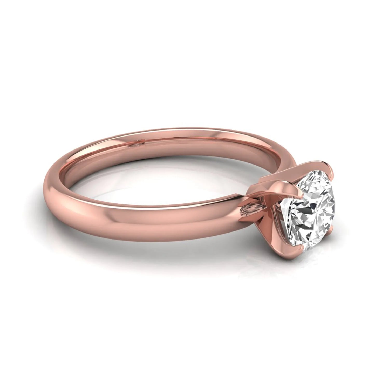 Round four prong lab grown diamond solitaire engagement ring featuring a 0.62 carat round center diamond in a classic four-prong setting in rose gold