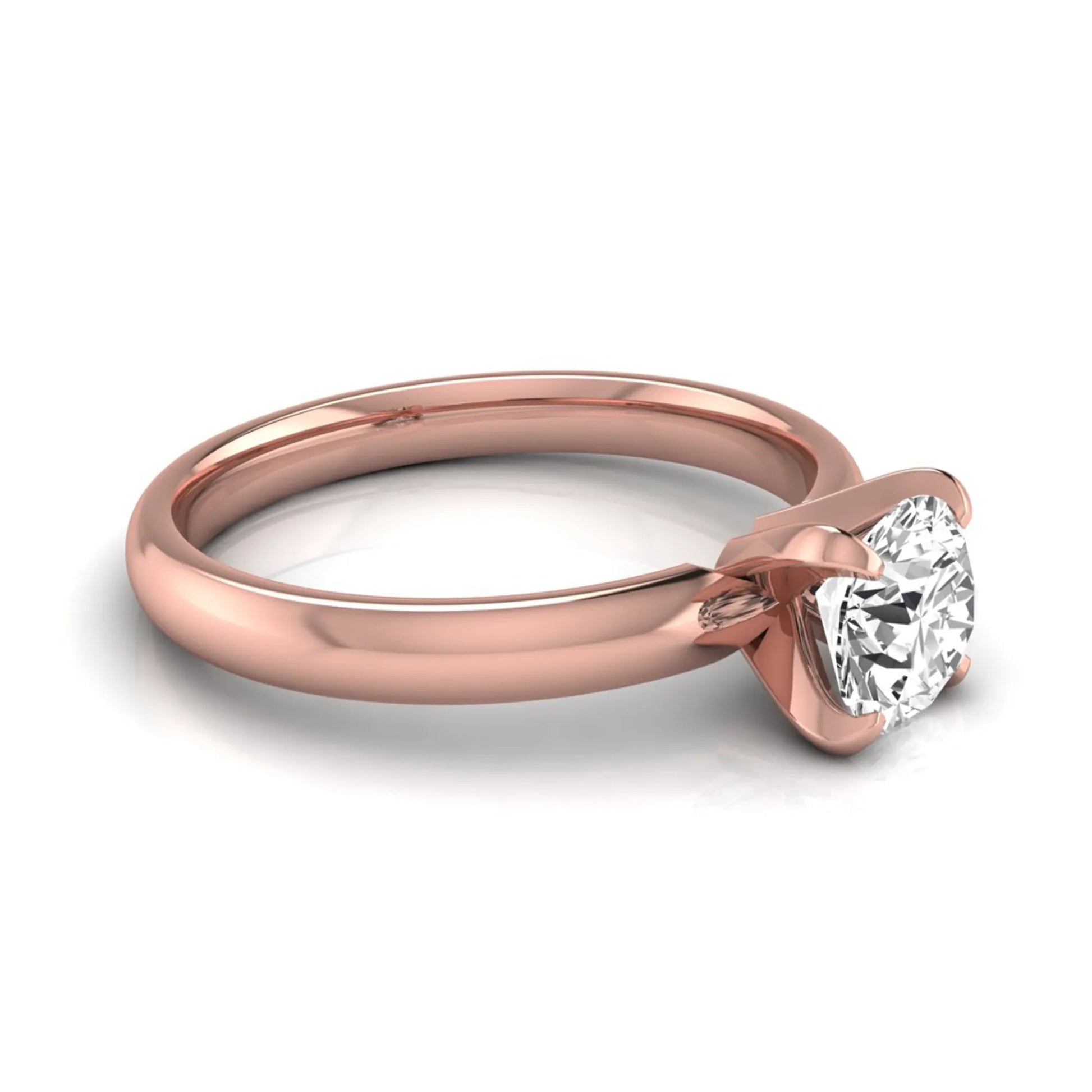 Round four prong lab grown diamond solitaire engagement ring featuring a 0.62 carat round center diamond in a classic four-prong setting in rose gold