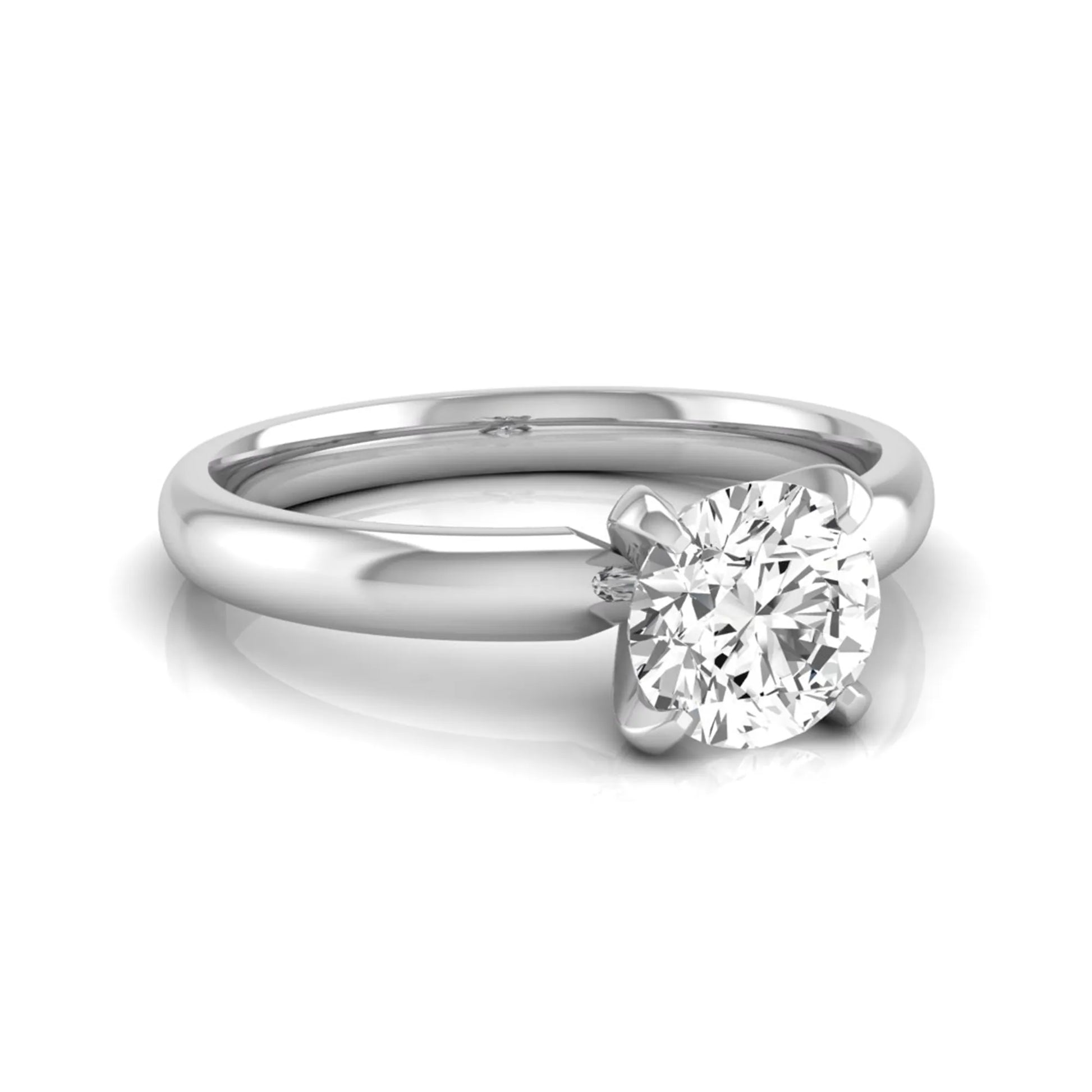 Round four prong lab grown diamond solitaire engagement ring featuring a 0.62 carat round center diamond in a classic four-prong setting in white gold