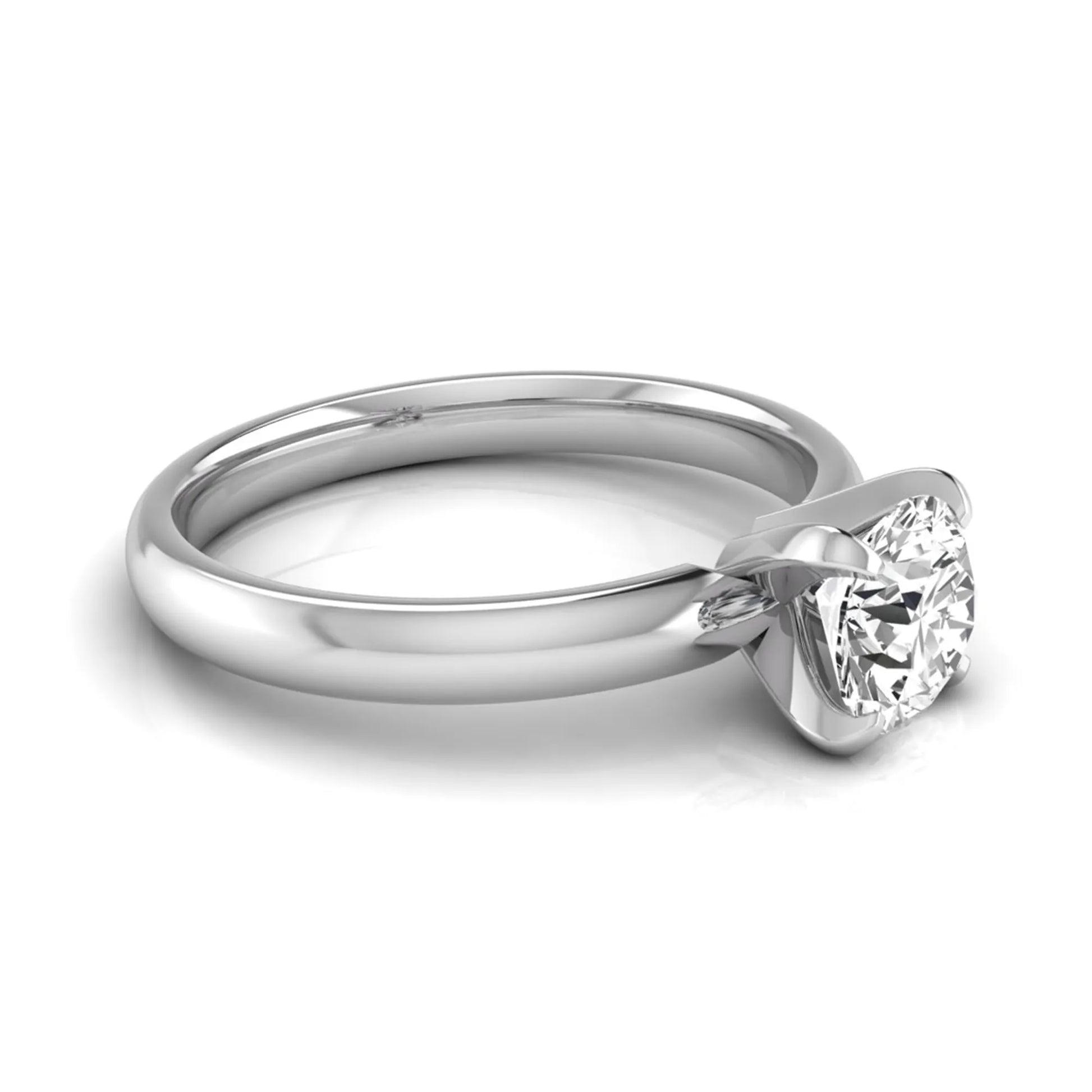 Round four prong lab grown diamond solitaire engagement ring featuring a 0.62 carat round center diamond in a classic four-prong setting in white gold