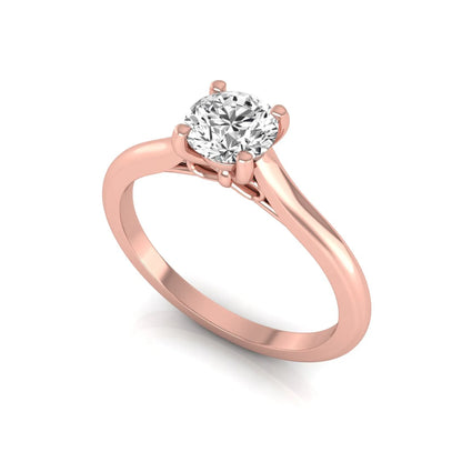 Round four prong lab grown diamond solitaire engagement ring featuring a 0.60 carat round cut center diamond in a classic rose gold design.