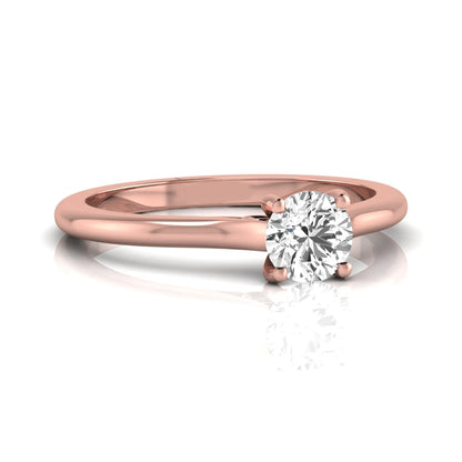 Round four prong lab grown diamond solitaire engagement ring featuring a 0.60 carat round cut center diamond in a classic rose gold design.