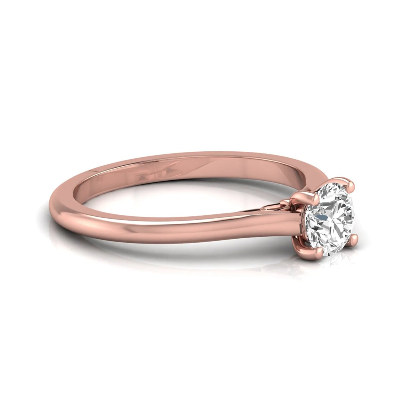 Round four prong lab grown diamond solitaire engagement ring featuring a 0.60 carat round cut center diamond in a classic rose gold design.