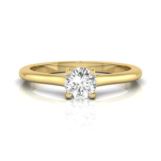 Round four prong lab grown diamond solitaire engagement ring featuring a 0.60 carat round cut center diamond in a classic yellow gold design.