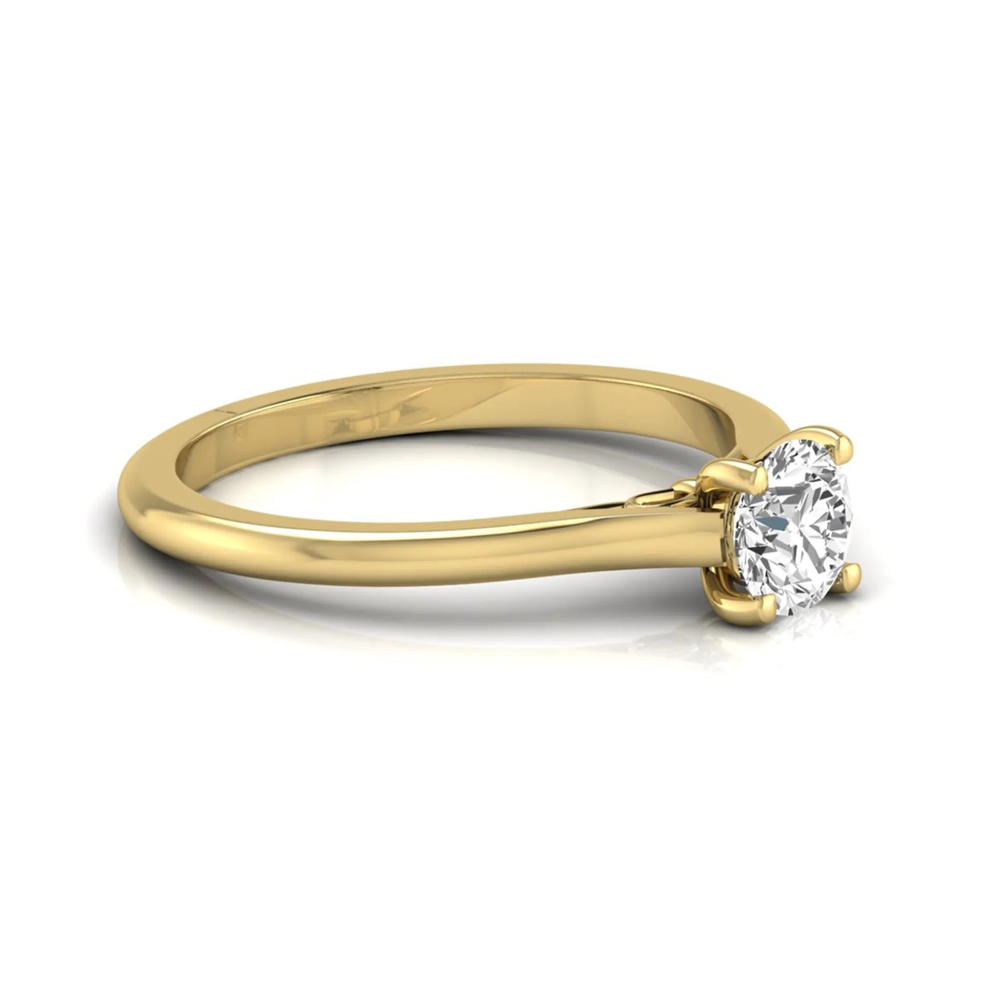 Round four prong lab grown diamond solitaire engagement ring featuring a 0.60 carat round cut center diamond in a classic yellow gold design.