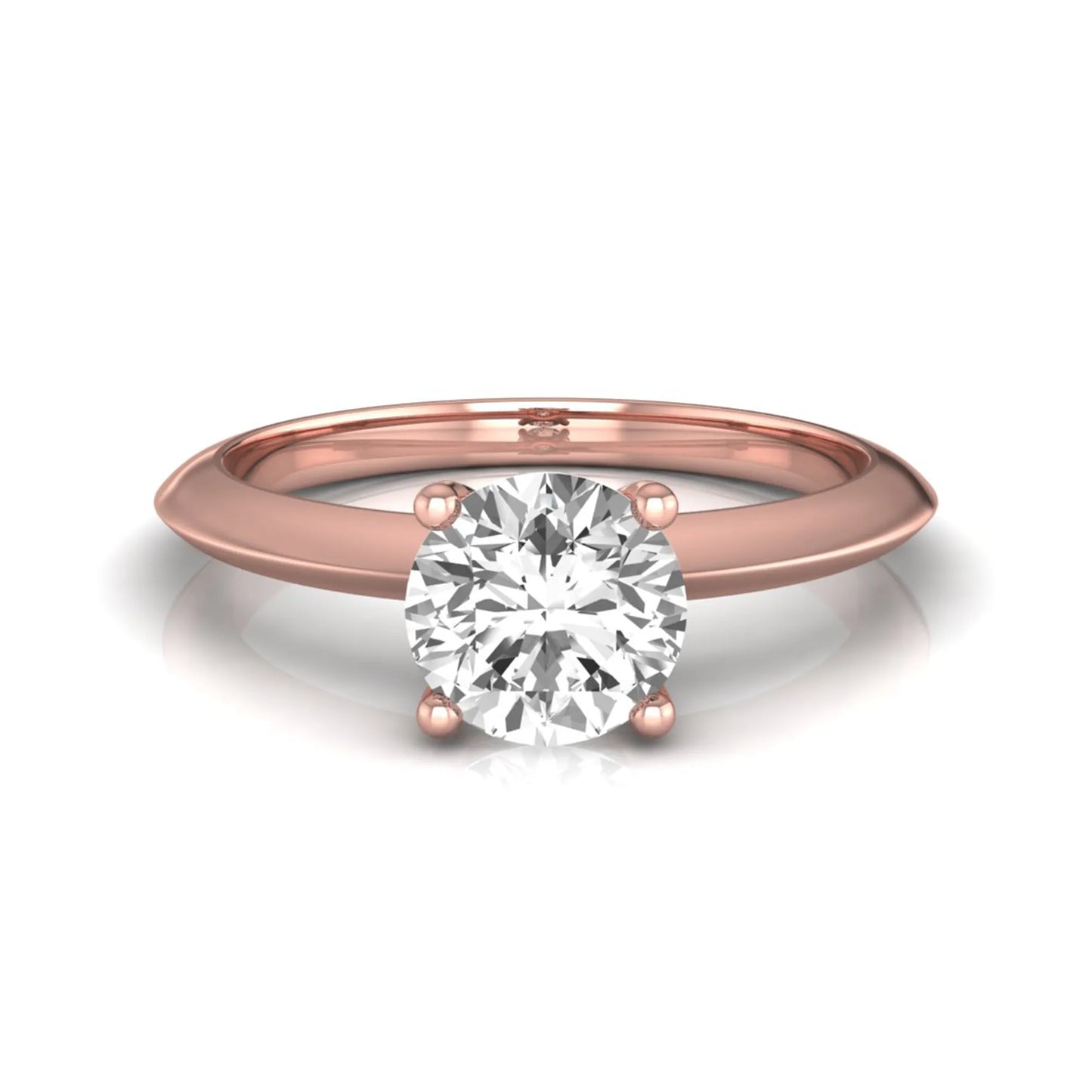 Round four prong lab grown diamond solitaire engagement ring featuring a 0.80 carat round cut center diamond in a classic rose gold design.