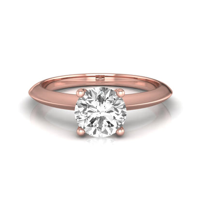 Round four prong lab grown diamond solitaire engagement ring featuring a 0.80 carat round cut center diamond in a classic rose gold design.