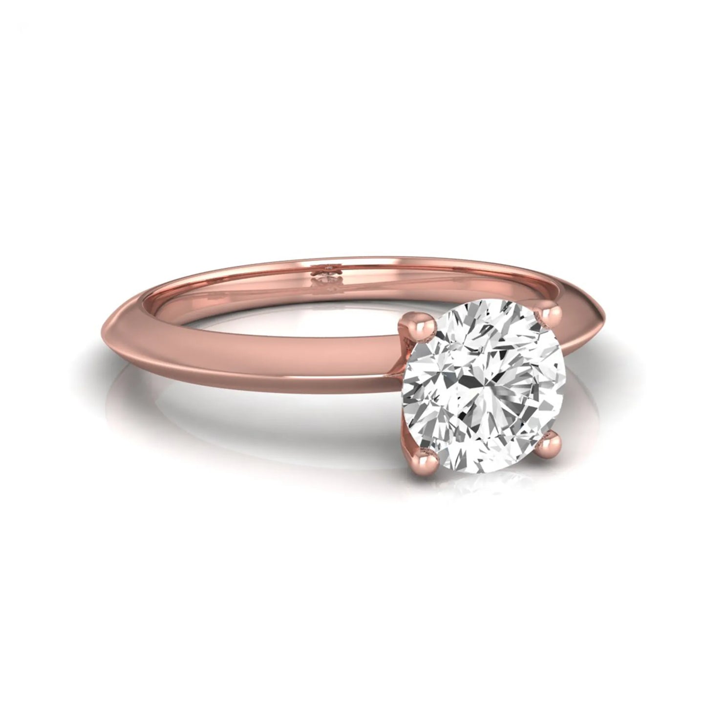 Round four prong lab grown diamond solitaire engagement ring featuring a 0.80 carat round cut center diamond in a classic rose gold design.